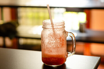 Strawberry smoothie in a glass bowl.