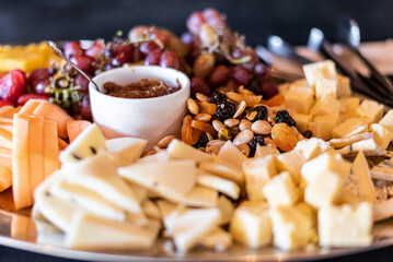 Cheese, Assorted nuts, grapes on a party platter