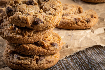 freshly baked Chocolate chip cookies on a wooden table with place for text. Copy space.