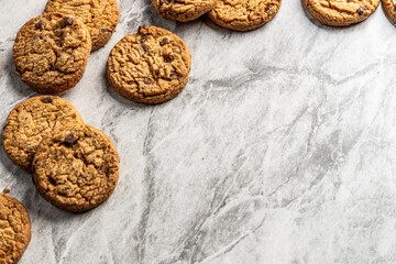 freshly baked Chocolate chip cookies on a marble countertop. Copy space.