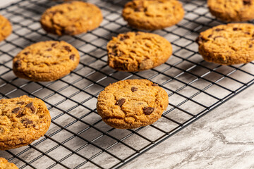 freshly baked Chocolate chip cookies on a marble countertop. Copy space.