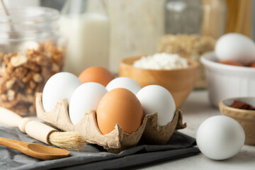 Fresh chicken white and brown eggs. Baking, cooking concept. Kitchen tools.