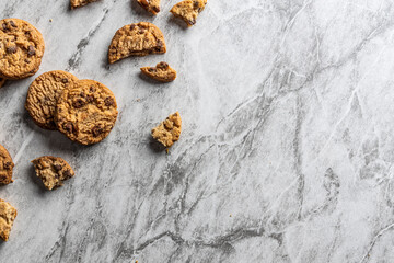freshly baked Chocolate chip cookies on a marble countertop. Copy space.