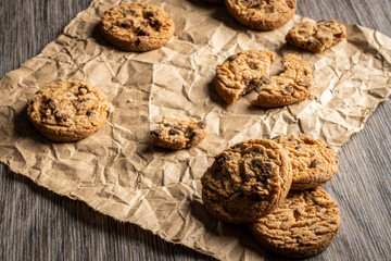 freshly baked Chocolate chip cookies on a wooden table with place for text. Copy space.