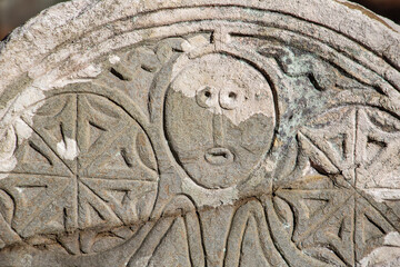 Detail of Headstone at Sawyer Hill Buying Ground, Newburyport MA. Built in 1695. Beautifully carved gravestone from the 1700's close up. Historic site.