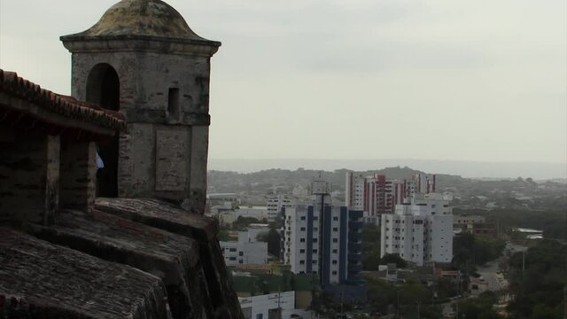 The watchtower of Castillo de San Felipe de Barajas overlooking modern city of Cartagena, Colombia.