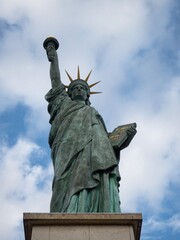 Closeup view of Statue of Liberty replica sculpture on Ile aux Cygnes at Pont de Grenelle Seine...