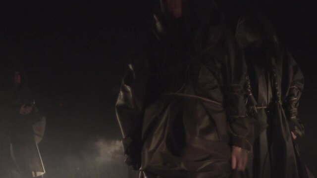 Sect. people in black coats. rite, cult