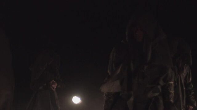 Sect. people in black coats. rite, cult