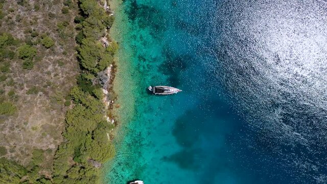 Boats Floating On Sparkling Blue Water Of Sea In Lastovo Island, Croatia. - aerial drone, top view