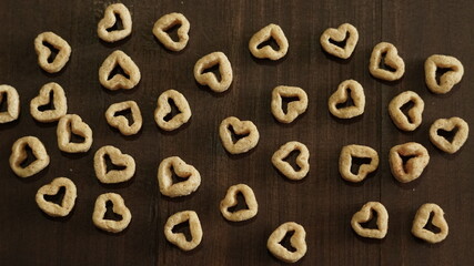 wooden background with cereal hearts decoration, health food background, healthy food background, natural healthy food background