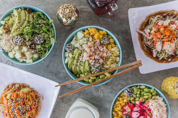 Healthy food and poke bowls in flat lay
