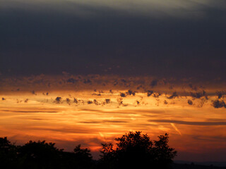 Fototapeta premium Evening Sky With Sunset And Dancing Clouds