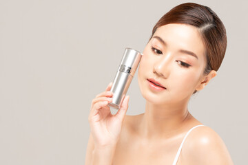 Beauty asian woman hold bottle cosmetic cream lotion  and cheerful.