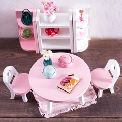 miniature table with h chairs in the living room, living room interior made of wood and plants, minimalistic concept. Miniature Wooden Toy Furniture for Children