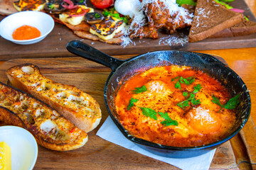 Delicious pan baked eggs with sour dough bread