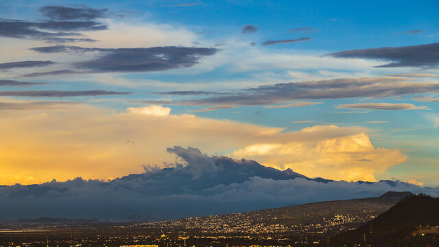 Sunrise over the volcanoes in a cloudy day