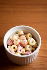 Cereal flakes in bowl ceramic with copy space,Breakfast concept.Food with delicious fruity taste and fruity colours.It's made with maize,wheat,and barley.