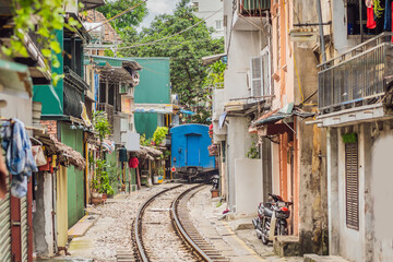 Fototapeta na wymiar City railway Perspective view running along narrow street with houses