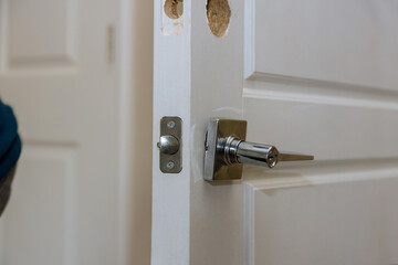 Installing the door lock in the new door locker