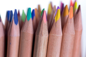 Cluster of sharpened color pencils on white background
