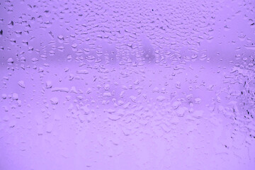 Wet glass texture. Abstract toned purple background. Pattern.