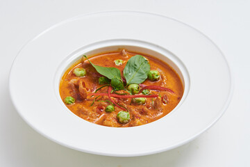 Thai style beef curry served on a white plate, a popular dish.