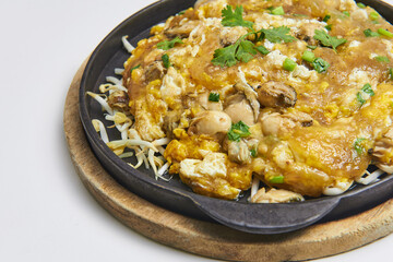 Hot Pan Oyster Fried with delicious crispy flour, add eggs and sprouted