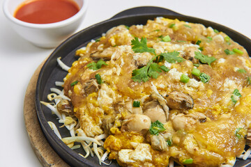 Hot Pan Oyster Fried with delicious crispy flour, add eggs and sprouted