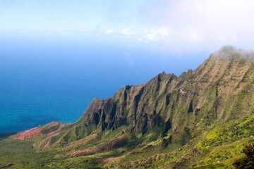Fototapeta premium View from the lookout in Kokee State Park of the rugged Napali Coast on a brilliant sunny day. 