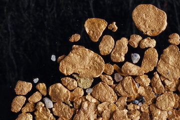 Macro photo of raw alluvial placer gold from British Columbia, Canada. Smaller raw...