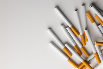 Many cigarettes stacked together. Drugs are harmful to the respiratory system.