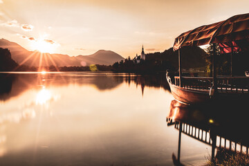 Boat in Lake Bled on the sunrise