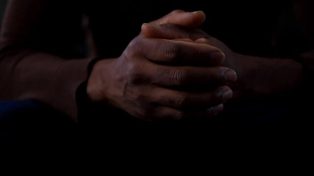 man praying to god with hands together Caribbean man praying stock footage stock video