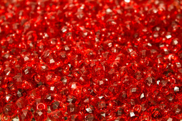 Group of bright red glass beads together for jewelllery
