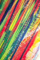 Background from different strokes of red, yellow, green and blue paint