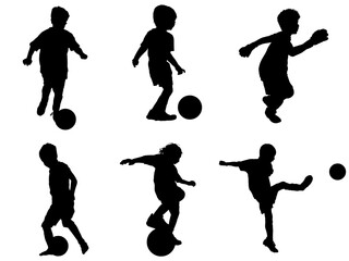 ボールをさばくサッカー少年のシルエット Wall Mural Mark