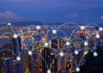 Wireless networking diagram over cityscape at night that represent the internet communication in worldwild.