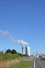 Factory with smoke coming out from its chimney - portrait