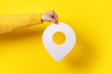 white map pointer 3d pin. Location symbol in hand over yellow background