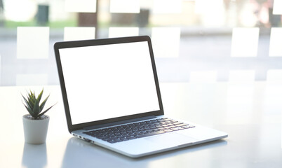 Fototapeta premium Workspace desk and laptop. copy space and blank screen. Business image, Blank screen laptop and supplies.