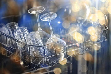 dishes in an open dishwasher, home style lifestyle, cleanliness and convenience background
