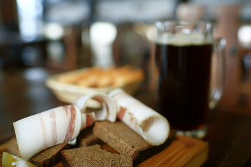 two beer mugs in a Czech beer restaurant / light and dark beer in large mugs traditional Prague pub