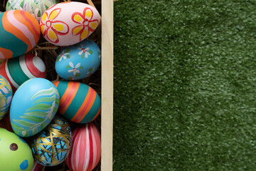 Easter eggs on wooden background with copy space,Colorful and handmade paint on eggs for easter day traditional in Europe,Easter Day Concept