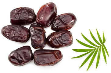date fruits with green leaves isolated on white background. clipping path. top view