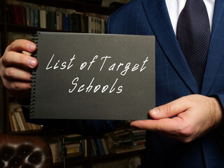 Business concept meaning List of Target Schools with phrase on the black notepad.