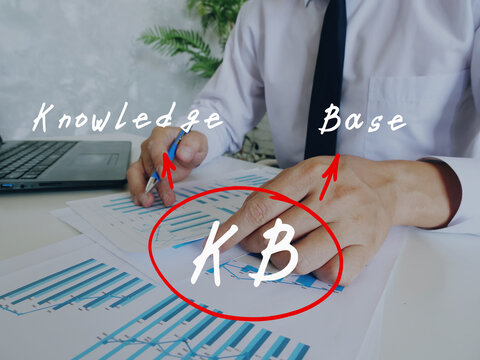 Conceptual photo about KB Knowledge Base with written abbreviation. Business Man Checking Documents on background.