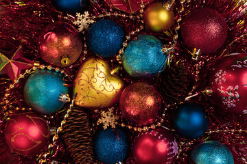 Amazing Christmas composition with blue and red christmas balls. Christmas or New Year concept. Dark festive background with baubles. Top view.