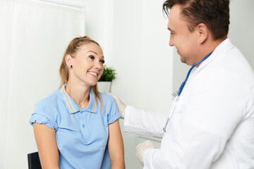 cheerful patient next to the doctor treatment lifestyle hospital