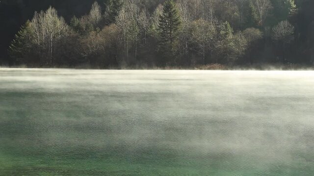 The morning mist floating over the lake. The beautiful Jiuzhaigou Valley, National Park in winter in aba prefecture, sichuan province, China. Inclusion on the World Natural Heritage List in 1992.